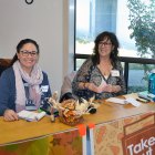 Volunteers take orders for take-out Thanksgiving dinners.